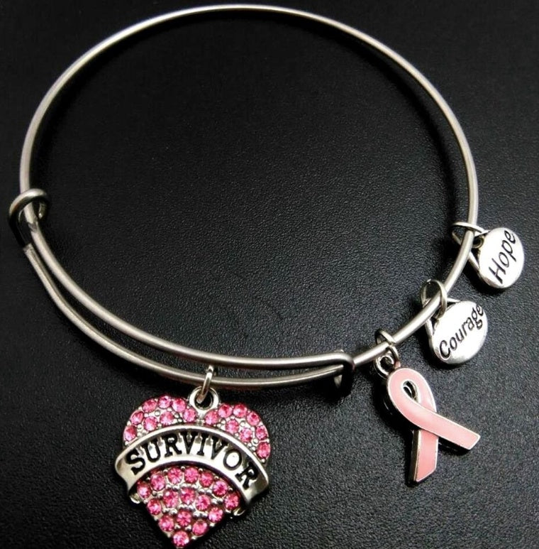 herzensmut – charm-armband mit pinker schleife & survivor-herz - lunastein
