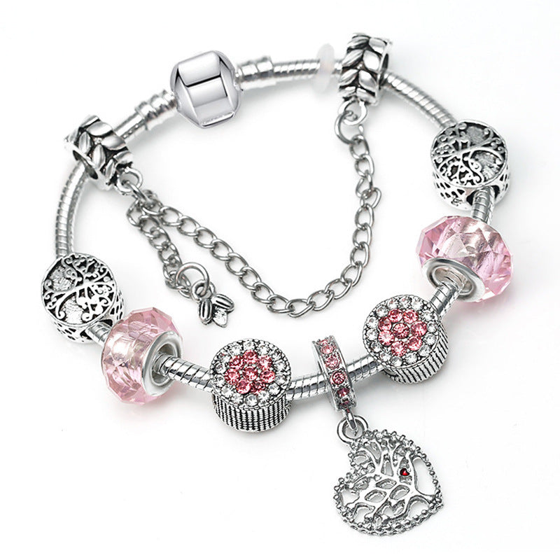 Royal Bloom – Charm-Armband mit Krönchen & Glanzdetails - Lunastein