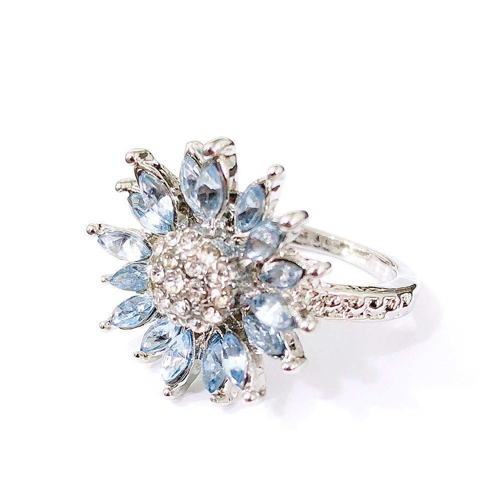 blossom light – sonnenblumen-ring mit hellblauen zirkonia-steinen - lunastein