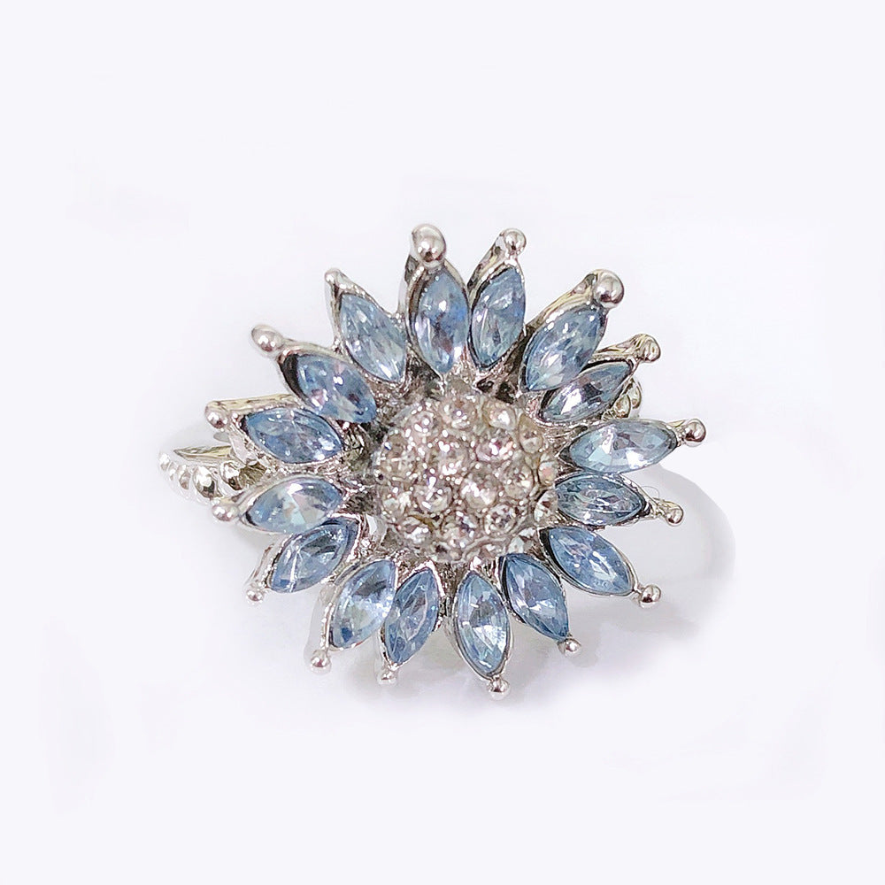 blossom light – sonnenblumen-ring mit hellblauen zirkonia-steinen - lunastein