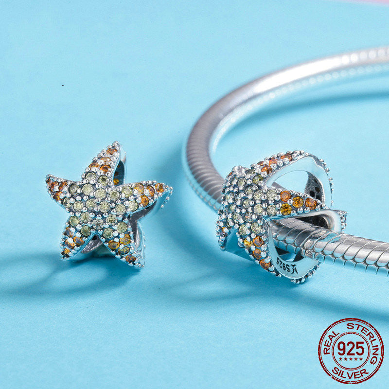 ocean spirit charm – anhänger mit delphinflosse & stern in 925 silber - lunastein