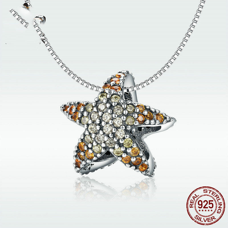 ocean spirit charm – anhänger mit delphinflosse & stern in 925 silber - lunastein