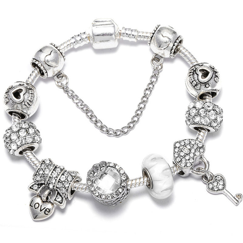 royal bloom – charm-armband mit krönchen & glanzdetails - lunastein