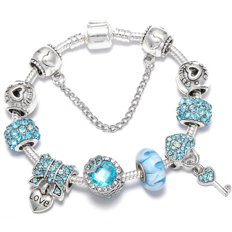 royal bloom – charm-armband mit krönchen & glanzdetails - lunastein