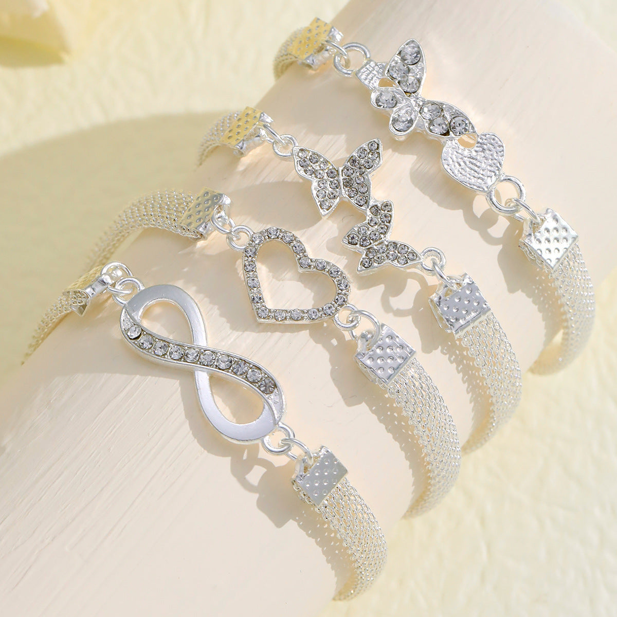 infinity grace – 4-teiliges silber-fußkettchen-set mit symbolen - lunastein - schmuck