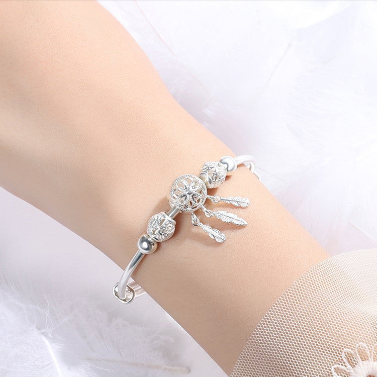 traumfängerlicht – charm-armband in silberoptik mit federanhängern - lunastein