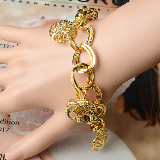 Spirit of Nature – Goldfarbenes Charm-Armband mit Elefanten & Lebensbaum - Lunastein
