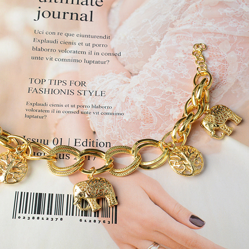 spirit of nature – goldfarbenes charm-armband mit elefanten & lebensbaum - lunastein