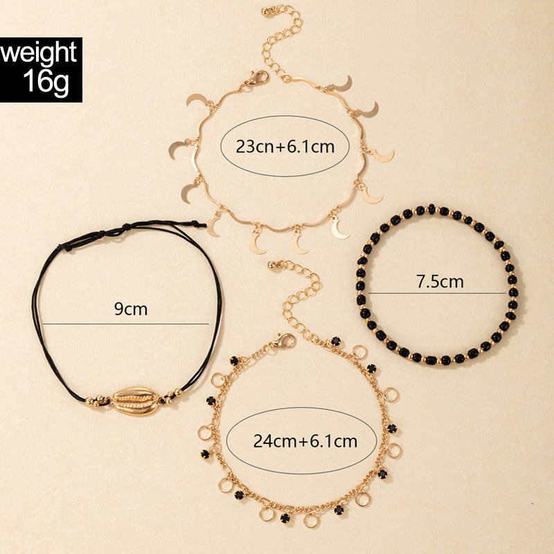 luna coast – 4-teiliges fußkettchen-set in gold & schwarz - lunastein - schmuck