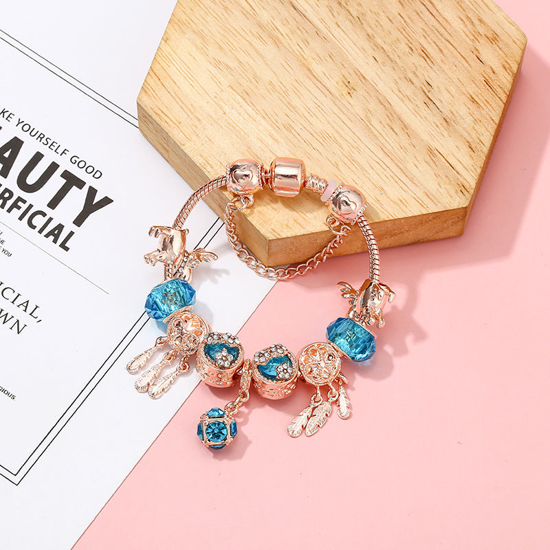 Dreamcatcher Tassel Bracelet – Roségoldenes Damenarmband mit Charms & Krone - Lunastein