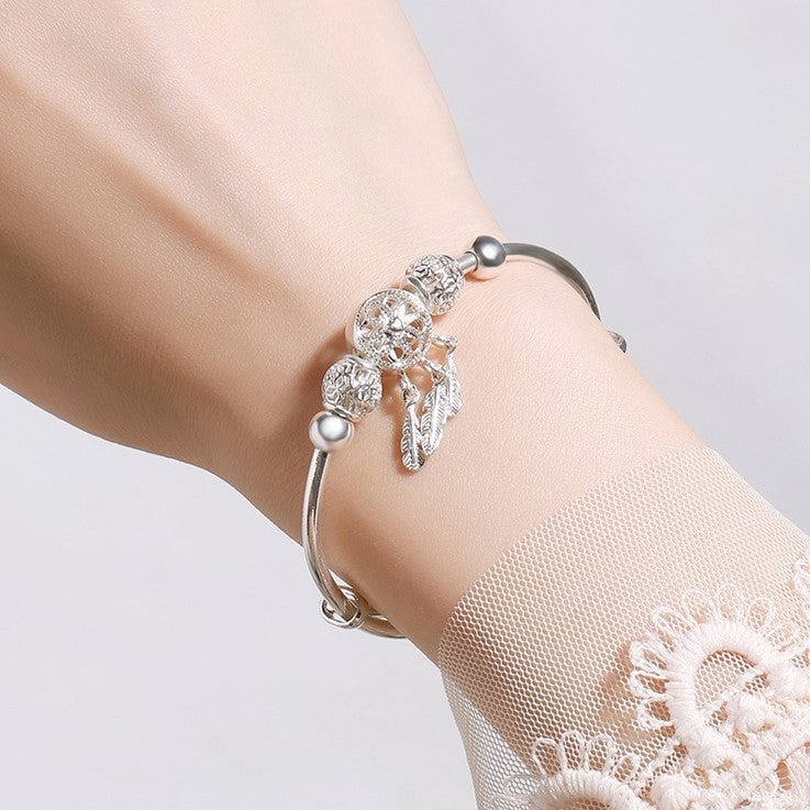 traumfängerlicht – charm-armband in silberoptik mit federanhängern - lunastein