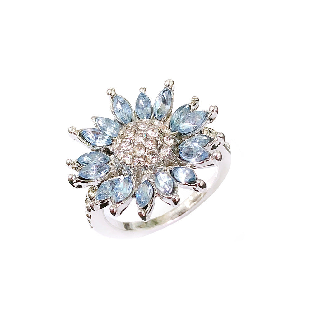 blossom light – sonnenblumen-ring mit hellblauen zirkonia-steinen - lunastein