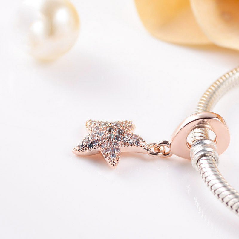 shiny ocean charm – roségoldener seestern-anhänger mit zirkonia aus 925 silber - lunastein