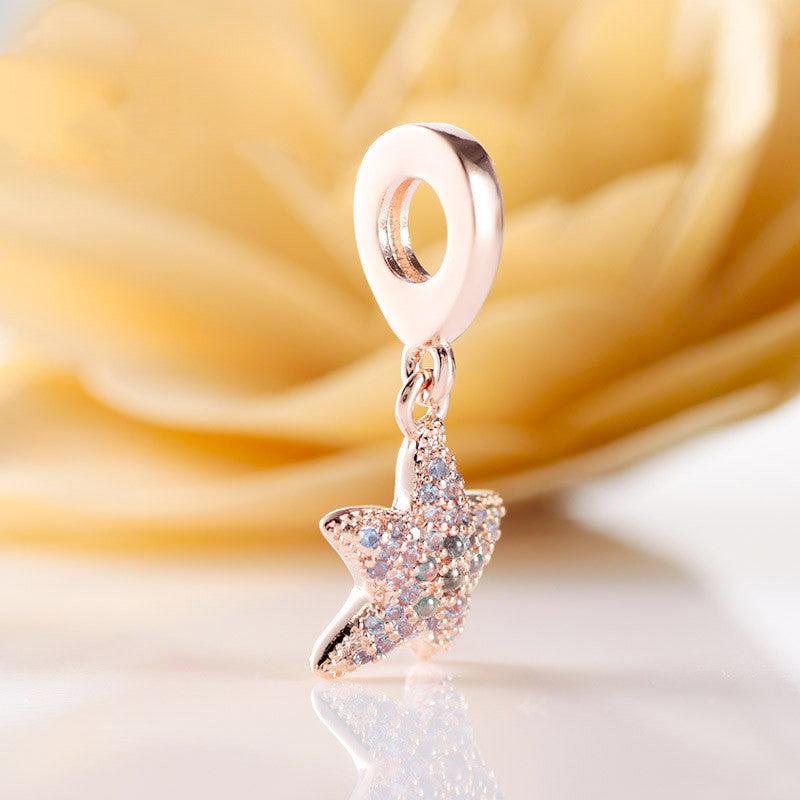 shiny ocean charm – roségoldener seestern-anhänger mit zirkonia aus 925 silber - lunastein