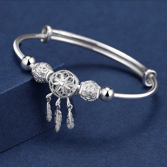 Traumfängerlicht – Charm-Armband in Silberoptik mit Federanhängern - Lunastein