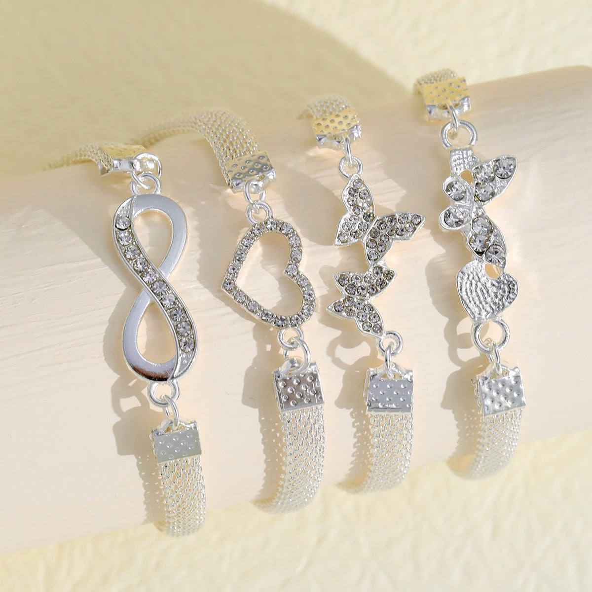 infinity grace – 4-teiliges silber-fußkettchen-set mit symbolen - lunastein - schmuck
