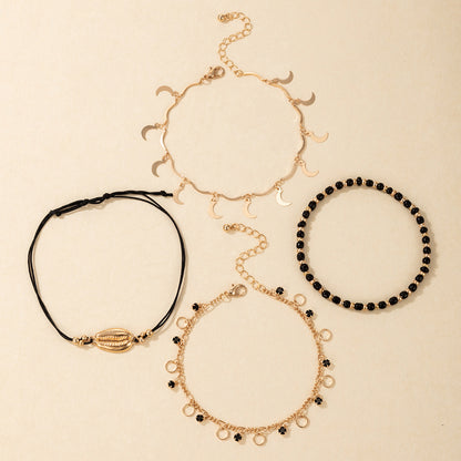 Luna Coast – 4-teiliges Fußkettchen-Set in Gold & Schwarz - Lunastein - Schmuck